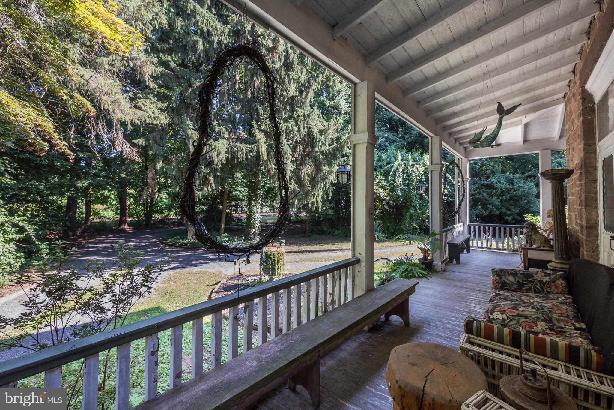 705 Woodlane Road Beverly, NJ 08010 - Photo 6 of 65 a view of a porch with wooden floor and furniture
