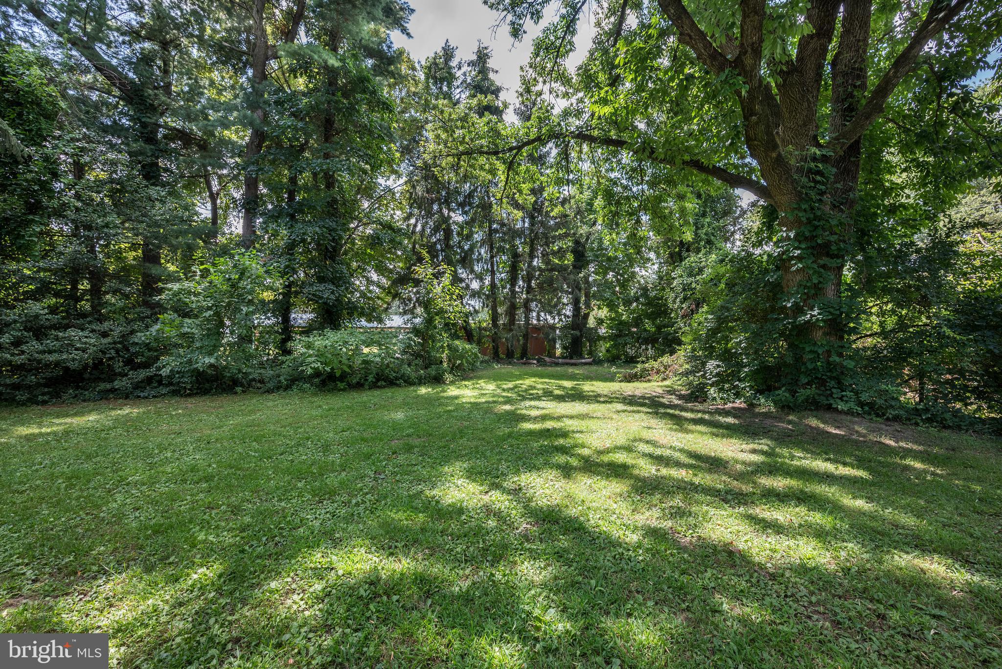 705 Woodlane Road Beverly, NJ 08010 - Photo 63 of 65 a view of outdoor space with deck and yard