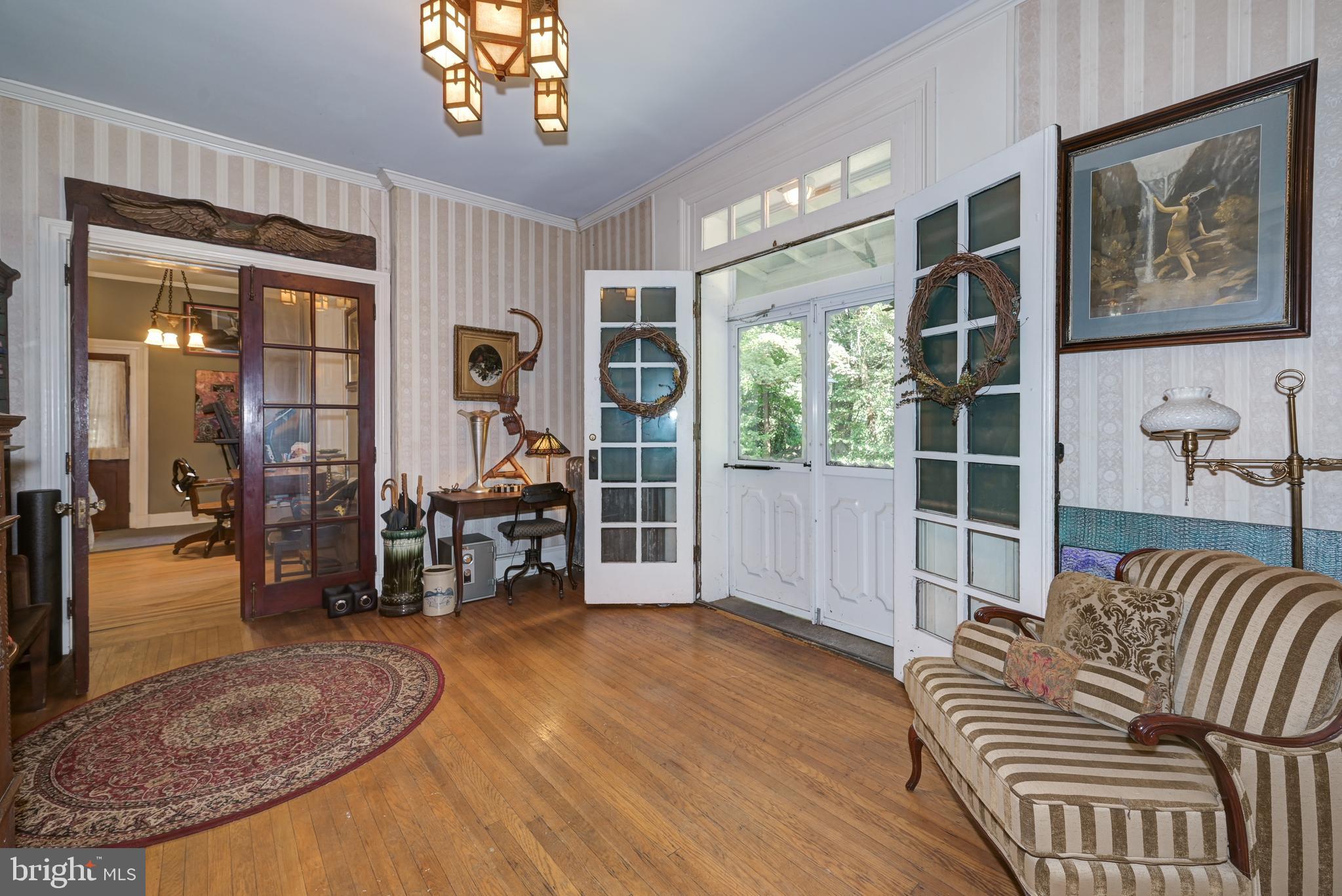 705 Woodlane Road Beverly, NJ 08010 - Photo 10 of 65 a view of livingroom with furniture and windows