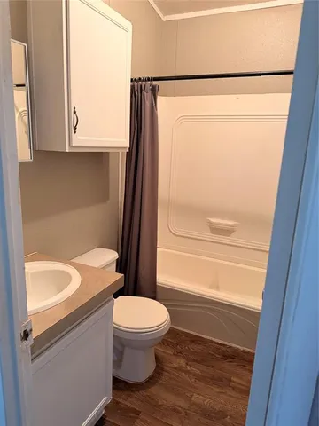 a bathroom with a toilet a sink and a bathtub