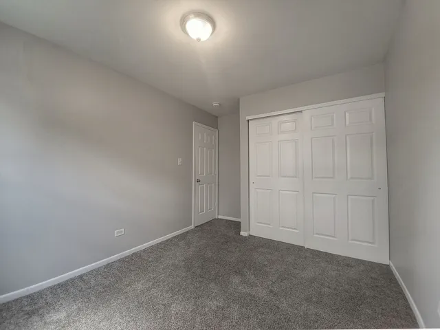 a view of a hallway with windows
