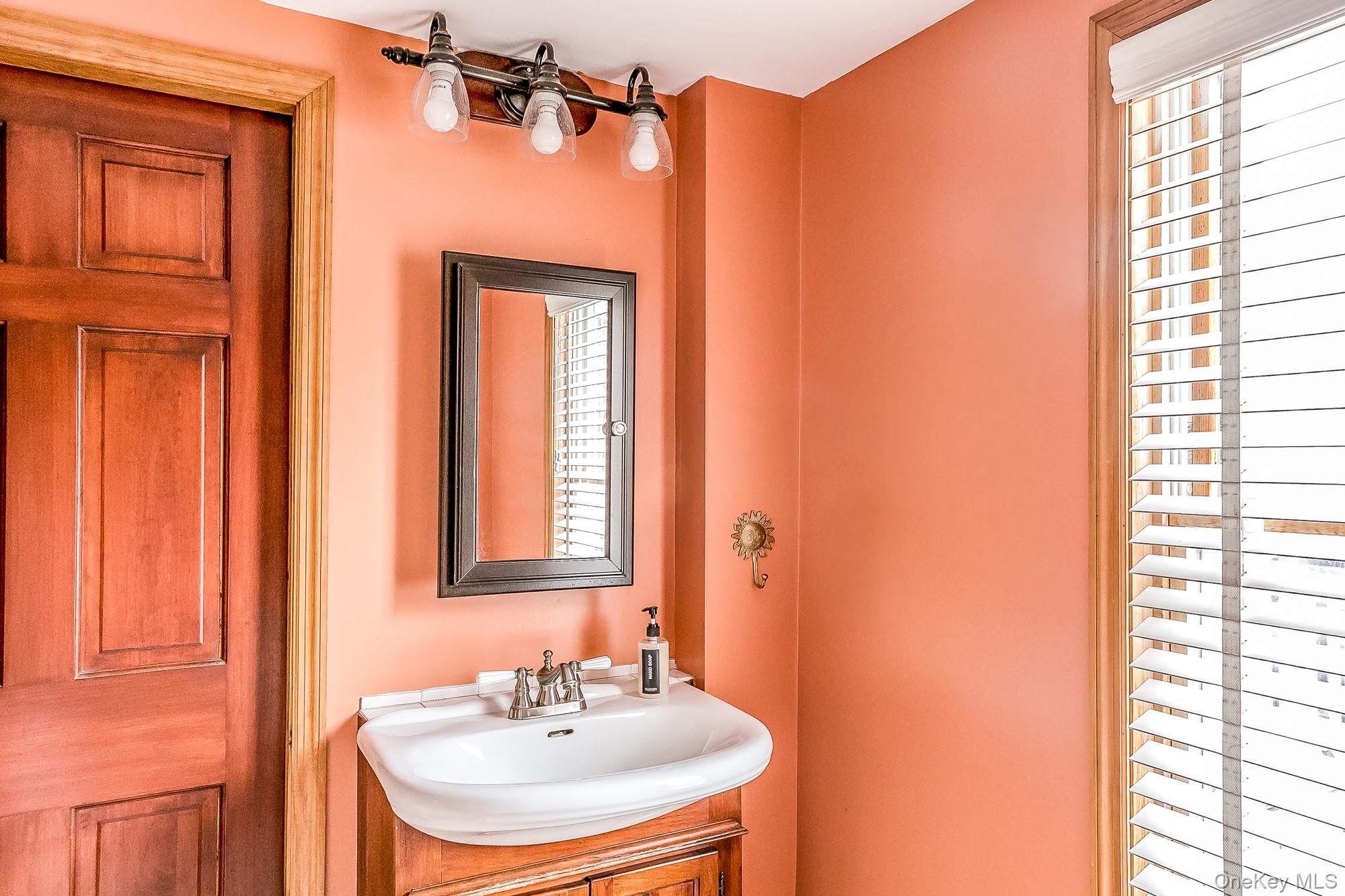 165 High Falls Road Extension Catskill, NY 12414 - Photo 11 of 28 a bathroom with a sink and a mirror