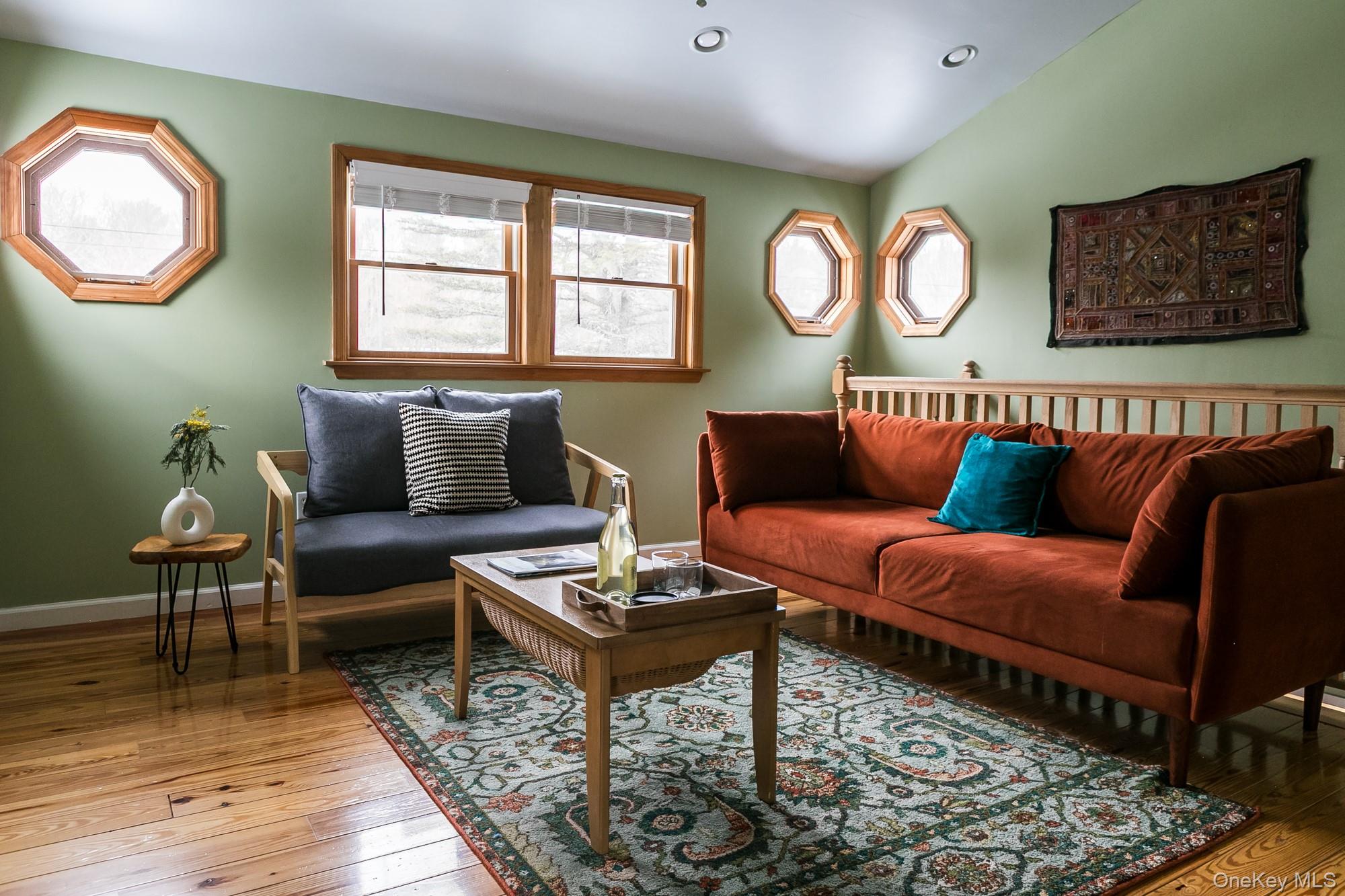 165 High Falls Road Extension Catskill, NY 12414 - Photo 12 of 28 a living room with furniture a rug and a window