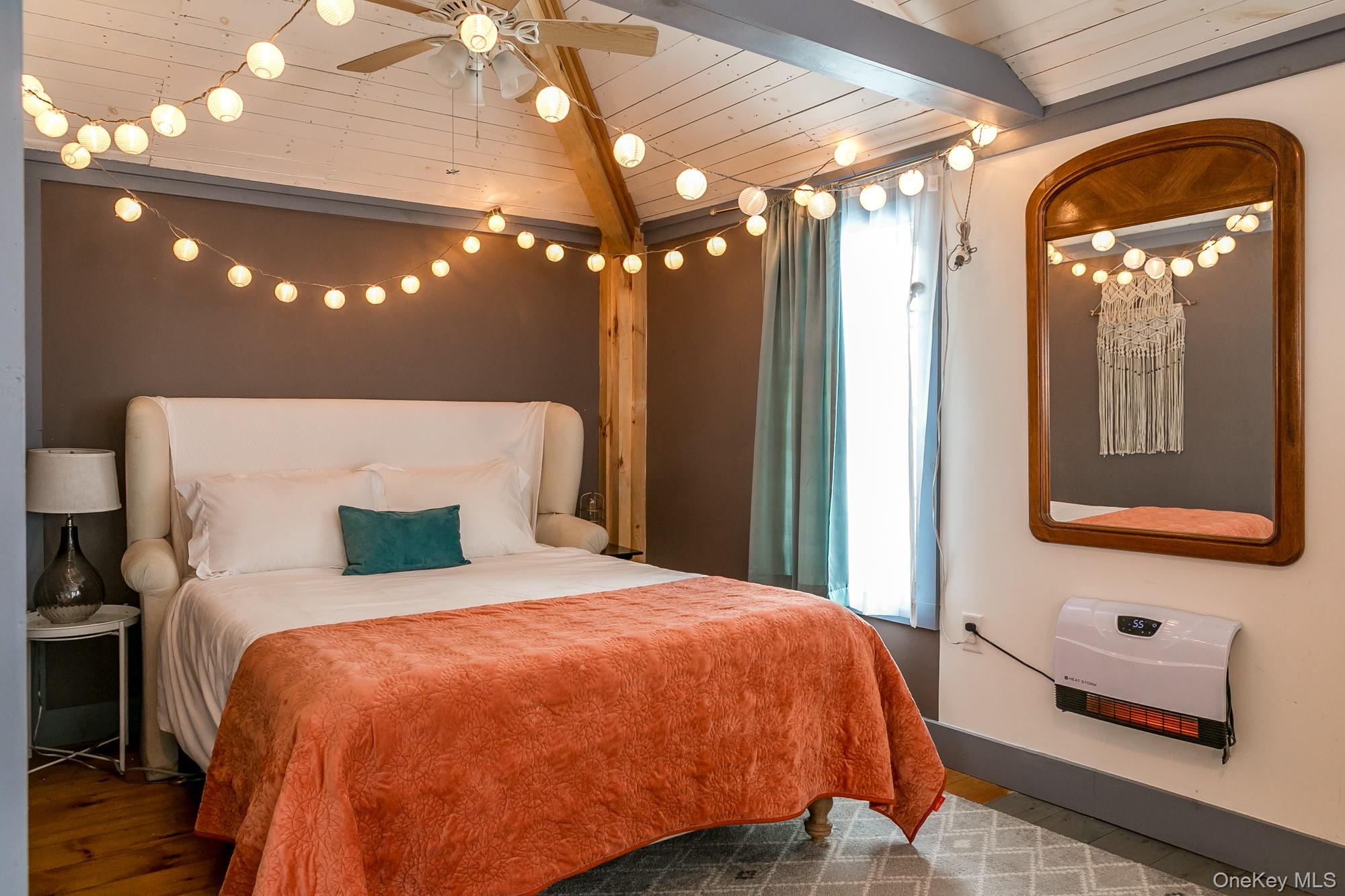 165 High Falls Road Extension Catskill, NY 12414 - Photo 20 of 28 a bed sitting in a bedroom next to a lamp