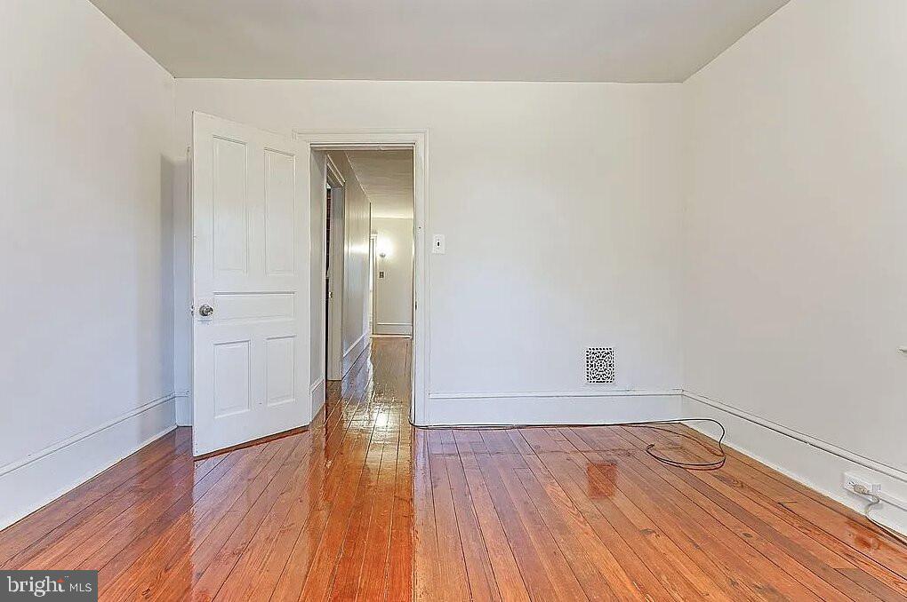 202 Cedar Avenue Pitman, NJ 08071 - Photo 11 of 11 a view of empty room with wooden floor