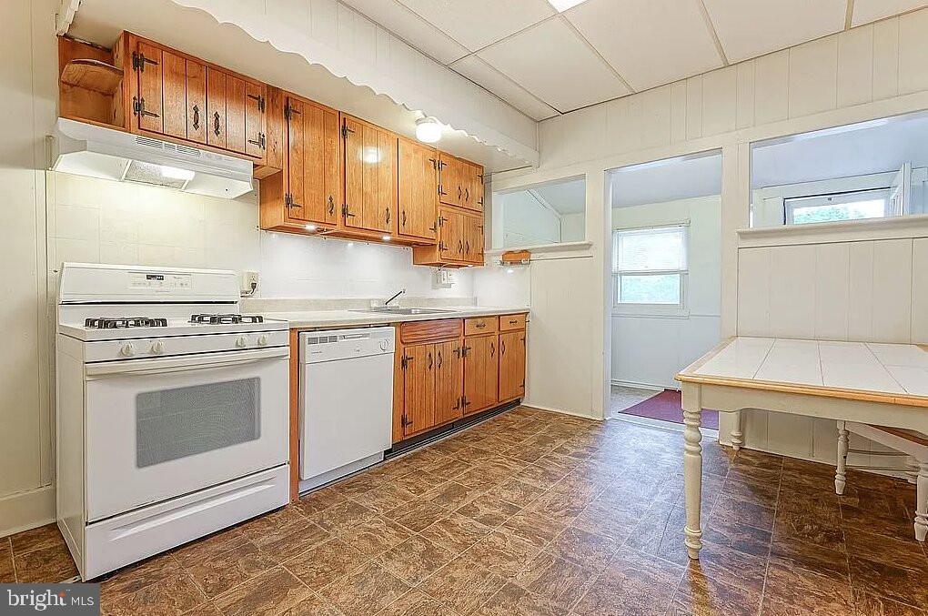 202 Cedar Avenue Pitman, NJ 08071 - Photo 5 of 11 a kitchen with a stove a sink and a refrigerator