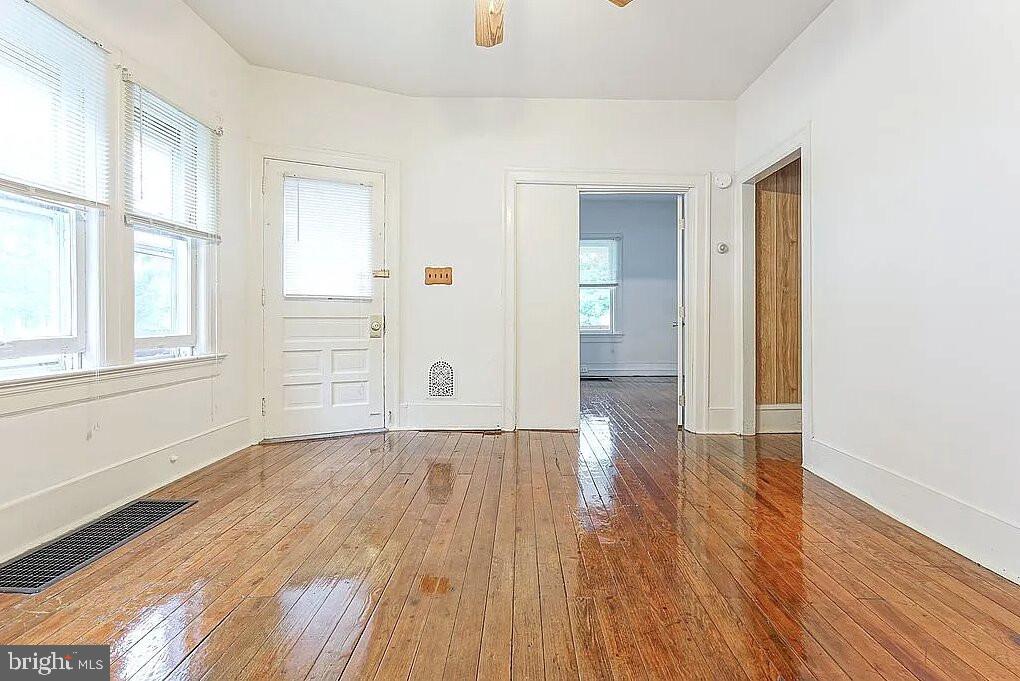 202 Cedar Avenue Pitman, NJ 08071 - Photo 6 of 11 wooden floor in an empty room with a window