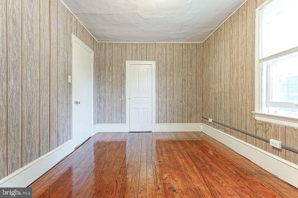 202 Cedar Avenue Pitman, NJ 08071 - Photo 10 of 11 wooden floor in an empty room with a window