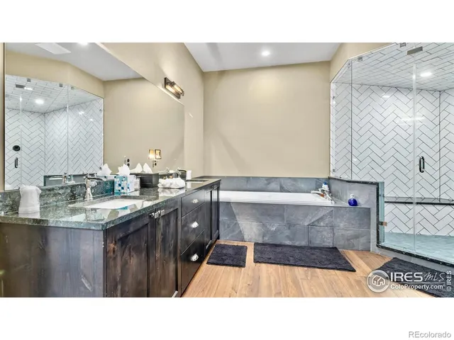 a bathroom with a sink a mirror and a bathtub