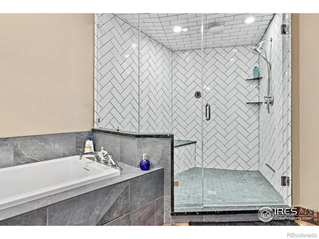 a bathroom with a bathtub and shower