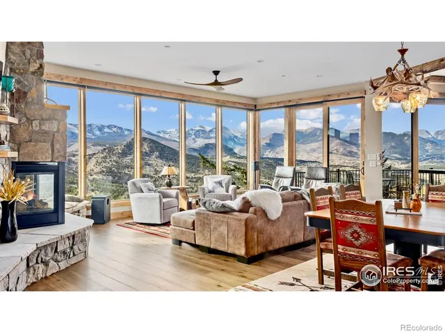 a living room with furniture and large windows