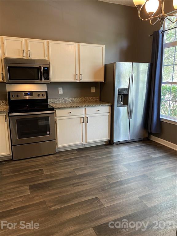 905 Lakehill Road Charlotte, NC 28214 - Photo 2 of 22 a kitchen with stainless steel appliances a stove microwave and refrigerator