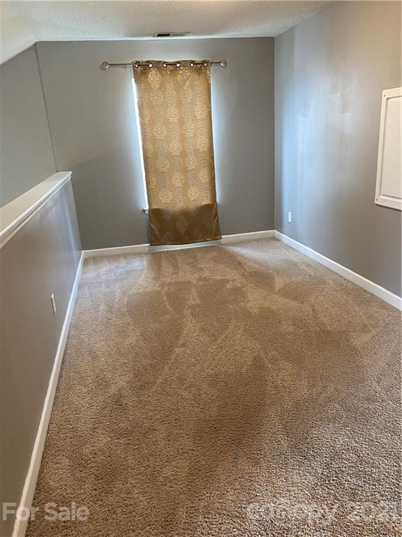 905 Lakehill Road Charlotte, NC 28214 - Photo 12 of 22 an empty room with a window