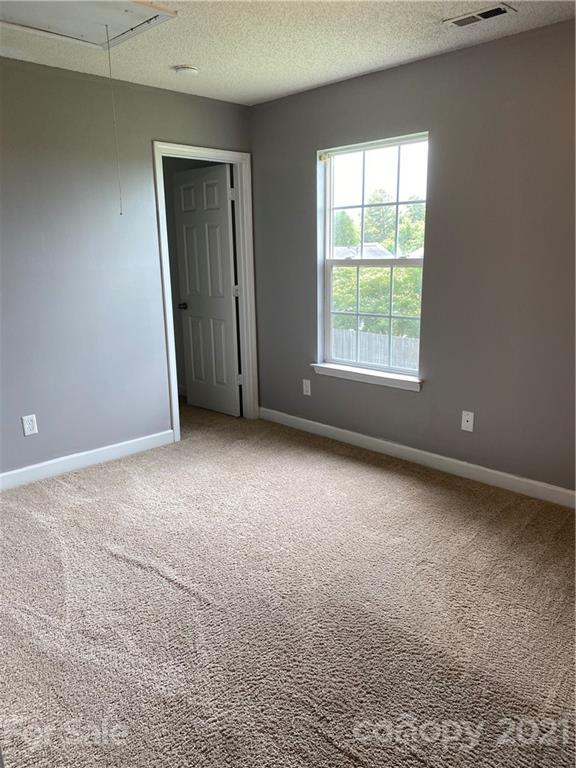 905 Lakehill Road Charlotte, NC 28214 - Photo 13 of 22 an empty room with a window