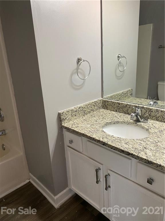 905 Lakehill Road Charlotte, NC 28214 - Photo 14 of 22 a bathroom with a granite countertop sink and a mirror
