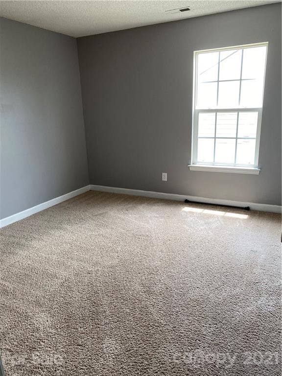 905 Lakehill Road Charlotte, NC 28214 - Photo 16 of 22 an empty room with windows