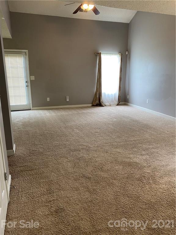 905 Lakehill Road Charlotte, NC 28214 - Photo 4 of 22 a view of an empty room with a window
