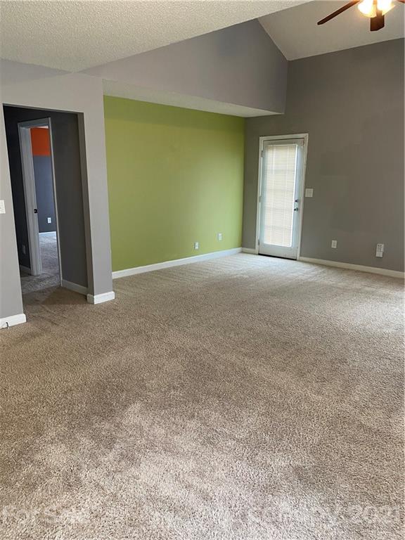 905 Lakehill Road Charlotte, NC 28214 - Photo 5 of 22 an empty room with windows