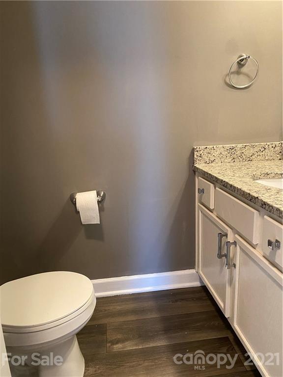 905 Lakehill Road Charlotte, NC 28214 - Photo 6 of 22 a bathroom with a granite countertop toilet and a sink