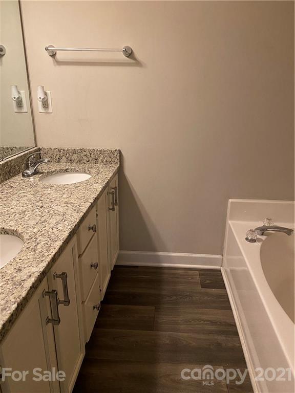 905 Lakehill Road Charlotte, NC 28214 - Photo 8 of 22 a bathroom with a granite countertop sink and a mirror