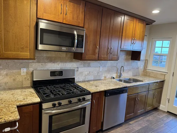 a kitchen with a stove and a microwave