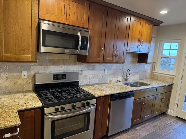 a kitchen with a stove and a microwave