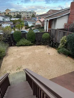 a view of a backyard of the house