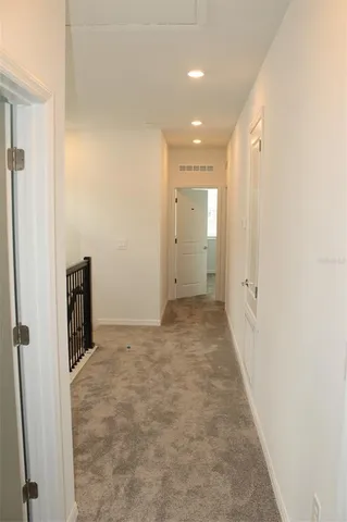a view of hallway with livingroom