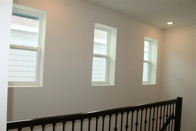 a view of empty room with windows