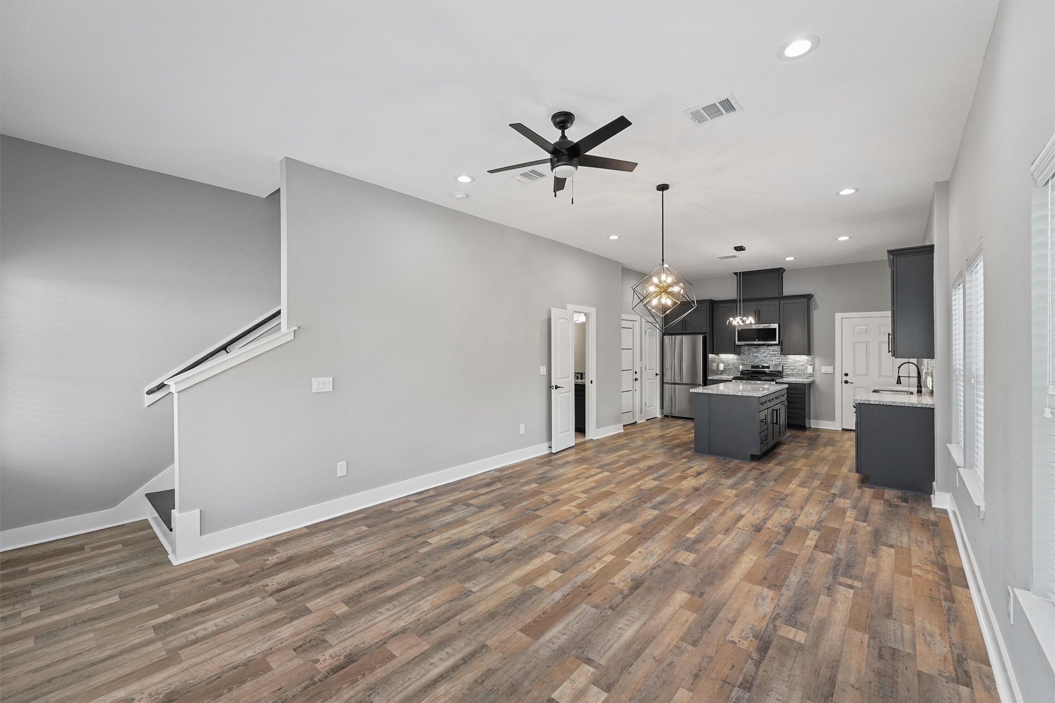 7704 Sealey Street Houston, TX 77088 - Photo 4 of 15 a view of a kitchen with a sink and a kitchen