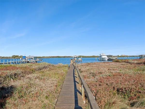 an aerial view of a house with a ocean view