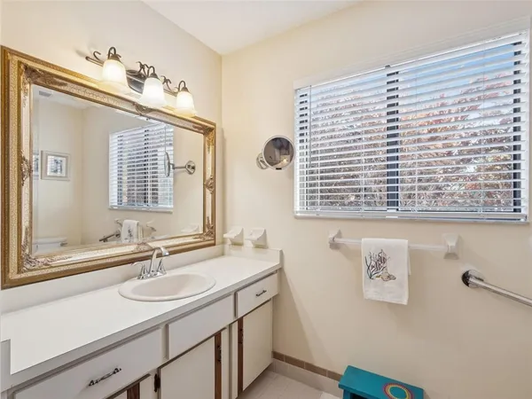 a room with a bed and a book shelf