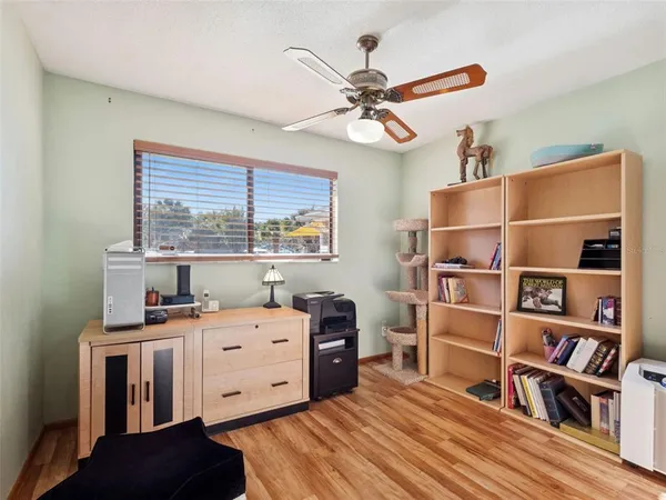 a bathroom with a sink a toilet a mirror a vanity and shower