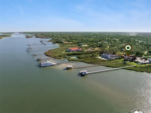 an aerial view of a city with ocean view
