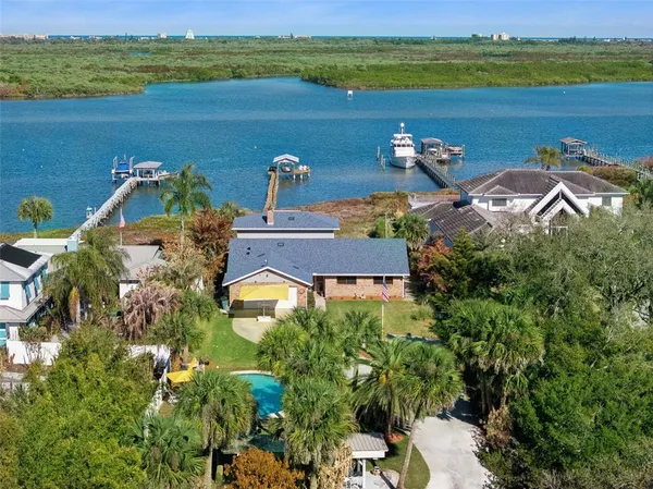 a view of a lake with a house in the background