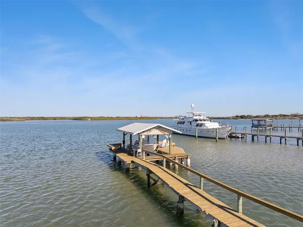 a view of a lake with outdoor seating