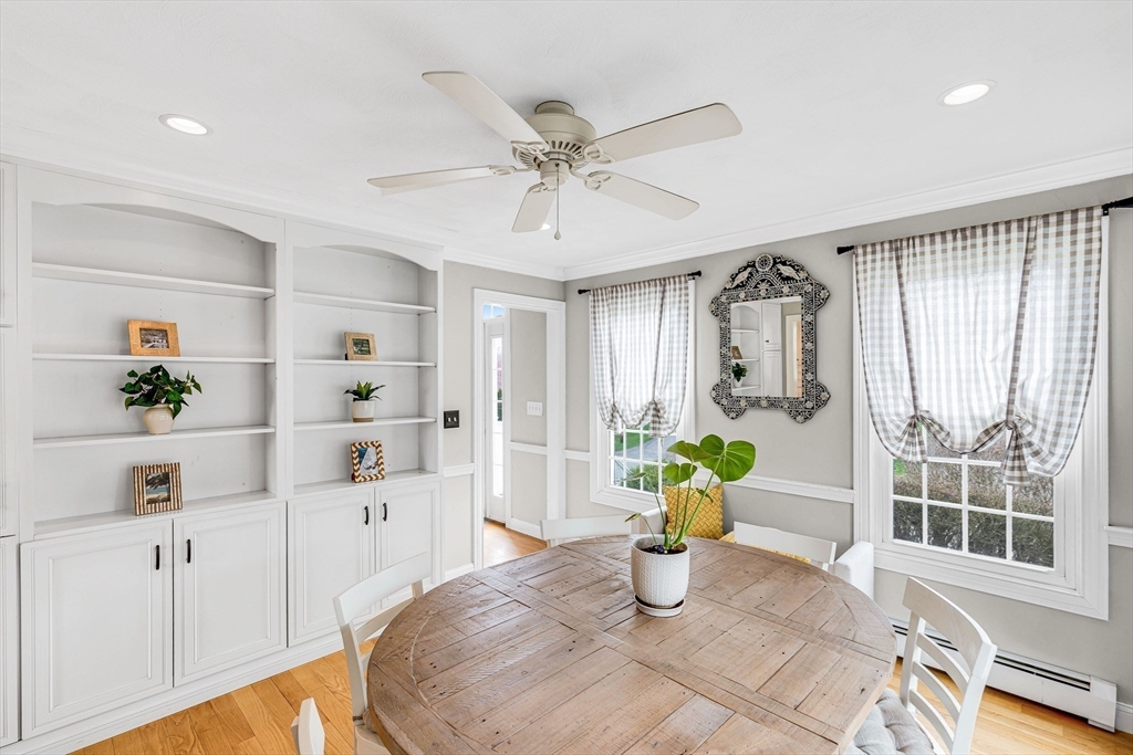 54 Old Merrill Street Amesbury, MA 01913 - Photo 17 of 34 a view of a dining room with a table and chairs