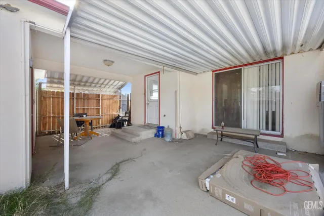a view of house with backyard and tub