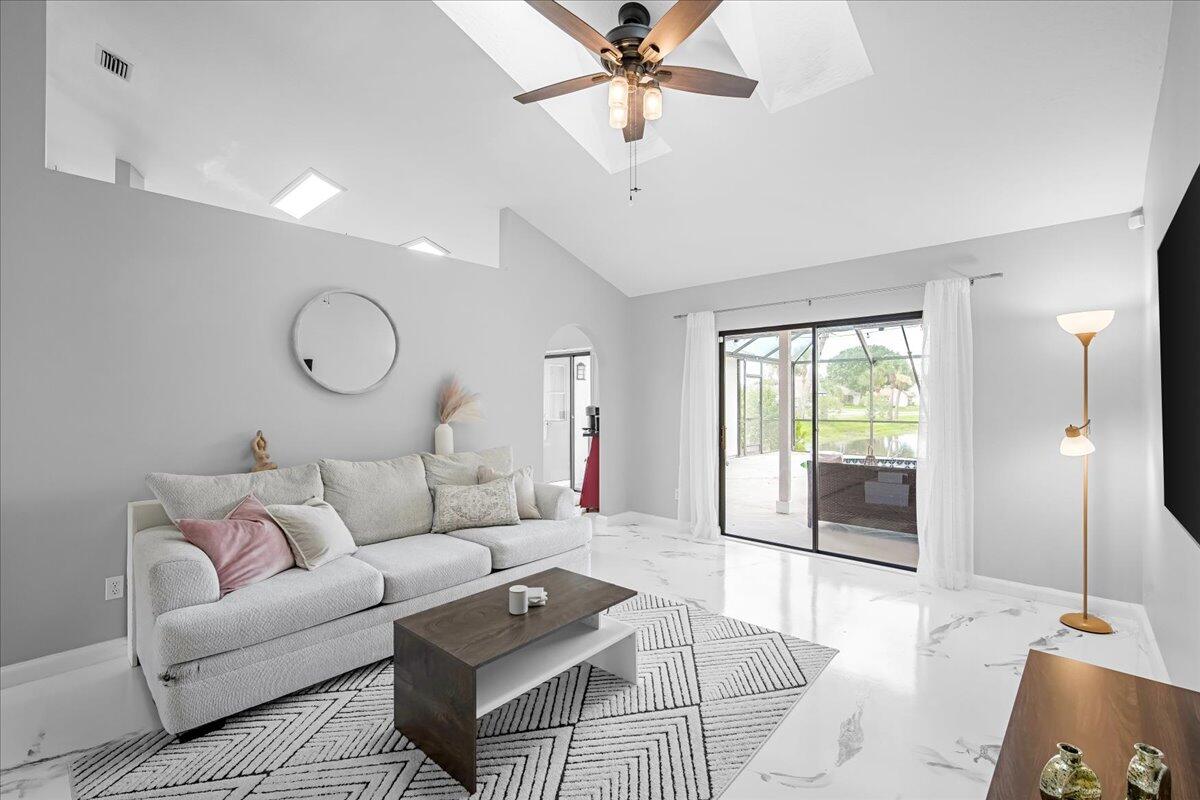 1901 Jacques Drive Melbourne, FL 32940 - Photo 14 of 43 a living room with furniture and a large window