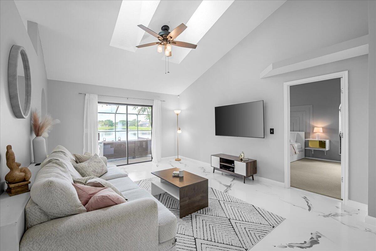 1901 Jacques Drive Melbourne, FL 32940 - Photo 15 of 43 a living room with furniture and a flat screen tv