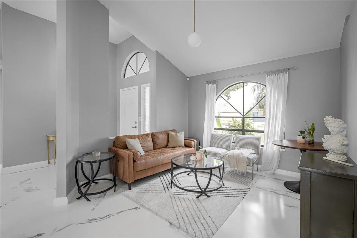 1901 Jacques Drive Melbourne, FL 32940 - Photo 17 of 43 a living room with furniture and a large window