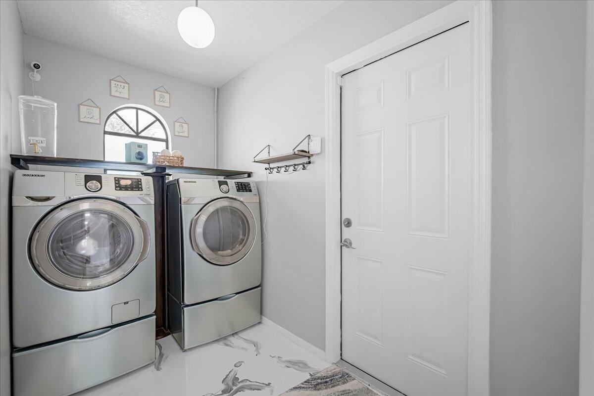 1901 Jacques Drive Melbourne, FL 32940 - Photo 18 of 43 a utility room with dryer and washer