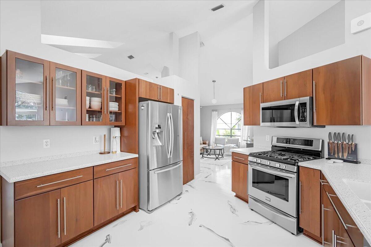 1901 Jacques Drive Melbourne, FL 32940 - Photo 20 of 43 a kitchen with stainless steel appliances a refrigerator stove and sink