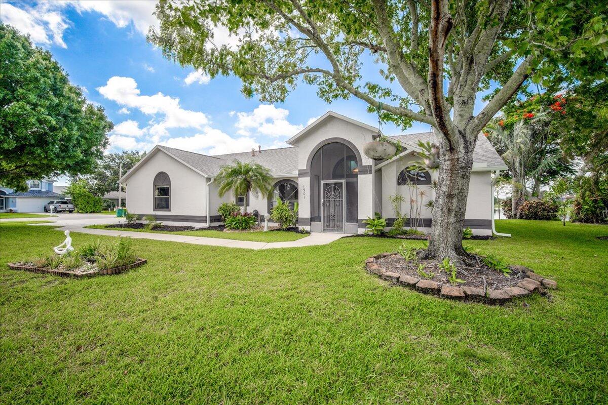 1901 Jacques Drive Melbourne, FL 32940 - Photo 2 of 43 a view of a house with swimming pool and a yard