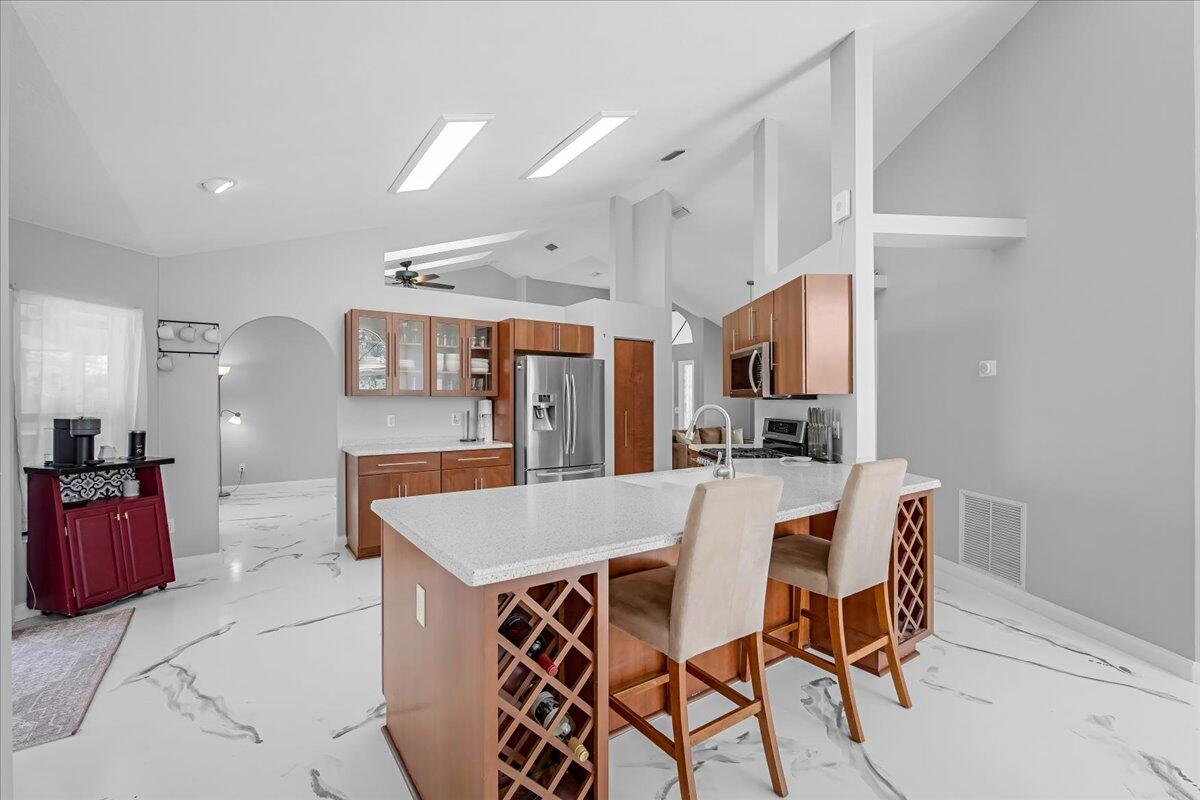 1901 Jacques Drive Melbourne, FL 32940 - Photo 23 of 43 a large kitchen with a table and chairs