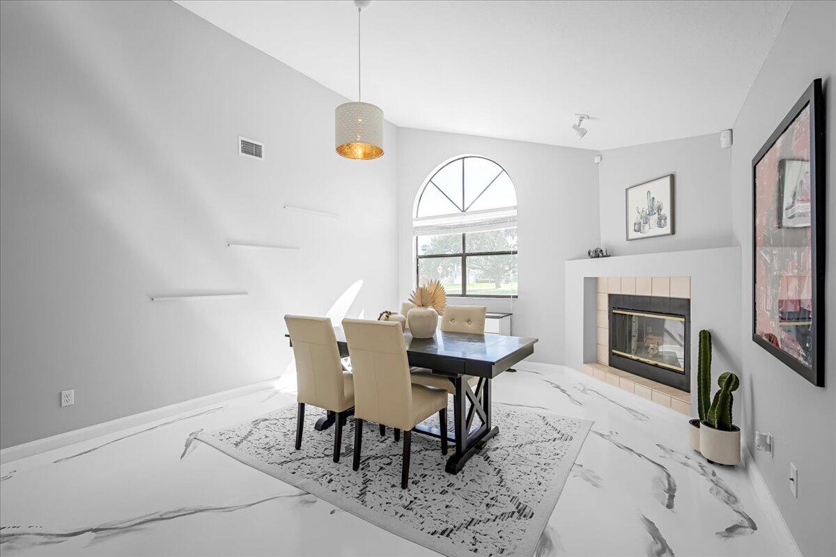 1901 Jacques Drive Melbourne, FL 32940 - Photo 26 of 43 a view of a dining room with furniture window and wooden floor