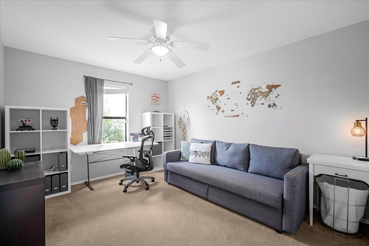 1901 Jacques Drive Melbourne, FL 32940 - Photo 30 of 43 a living room with furniture and a large window