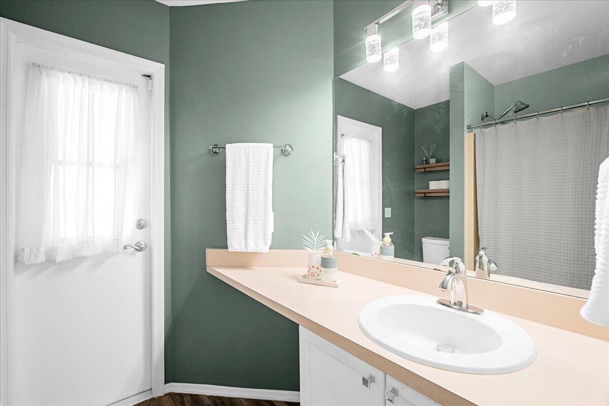 1901 Jacques Drive Melbourne, FL 32940 - Photo 31 of 43 a bathroom with a sink and a mirror
