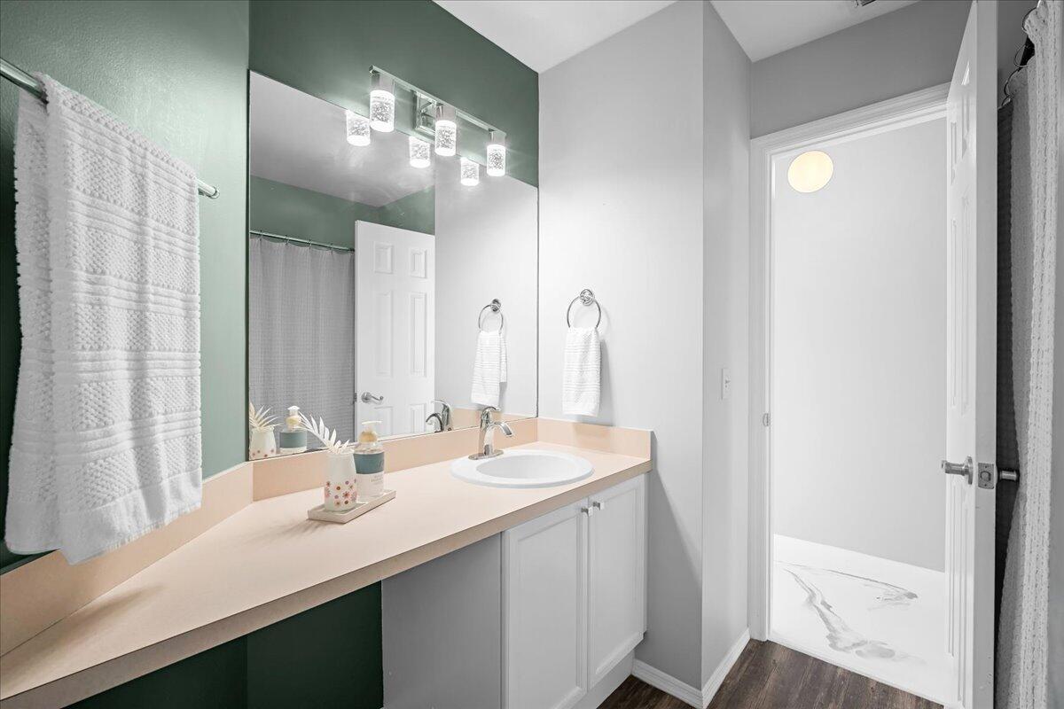 1901 Jacques Drive Melbourne, FL 32940 - Photo 32 of 43 a bathroom with a sink double vanity and a mirror