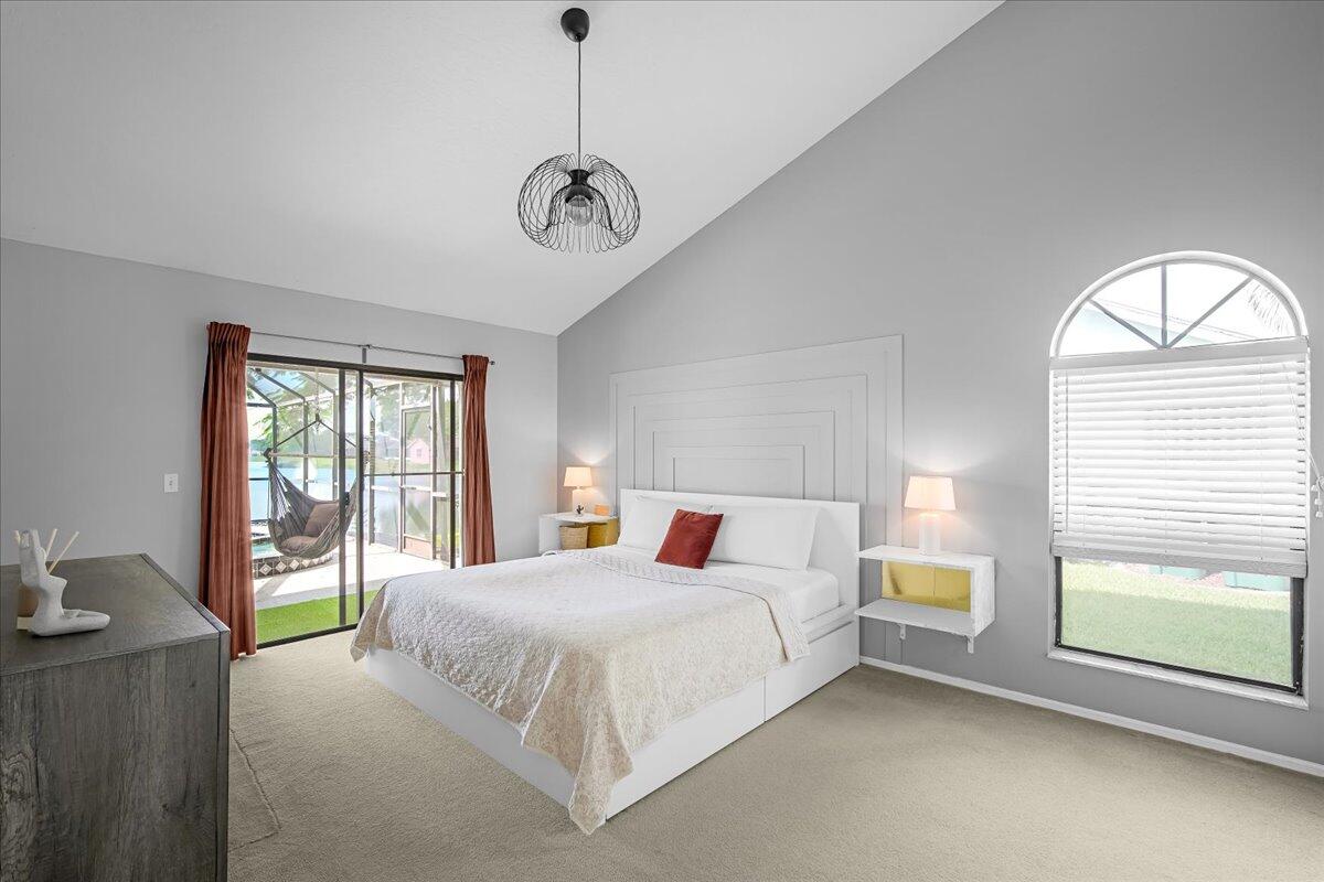 1901 Jacques Drive Melbourne, FL 32940 - Photo 33 of 43 a bedroom with a large bed and a large window